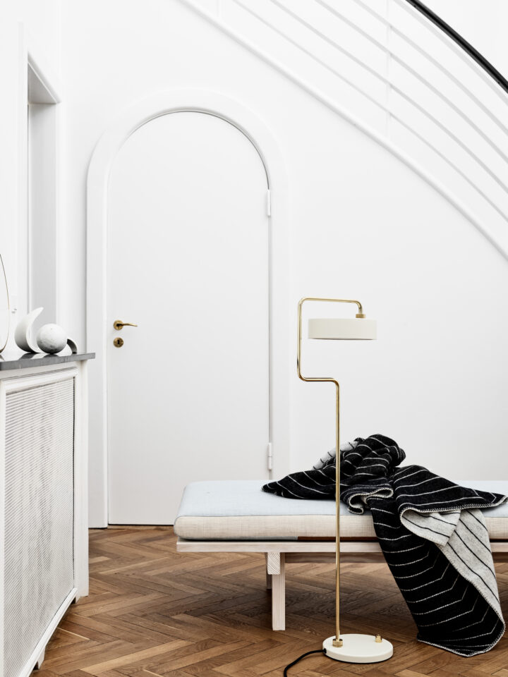 made-by-hand_petite-machine_floor-lamp_oyster-white_pinstripe-throw_black_lifestyle-720x960
