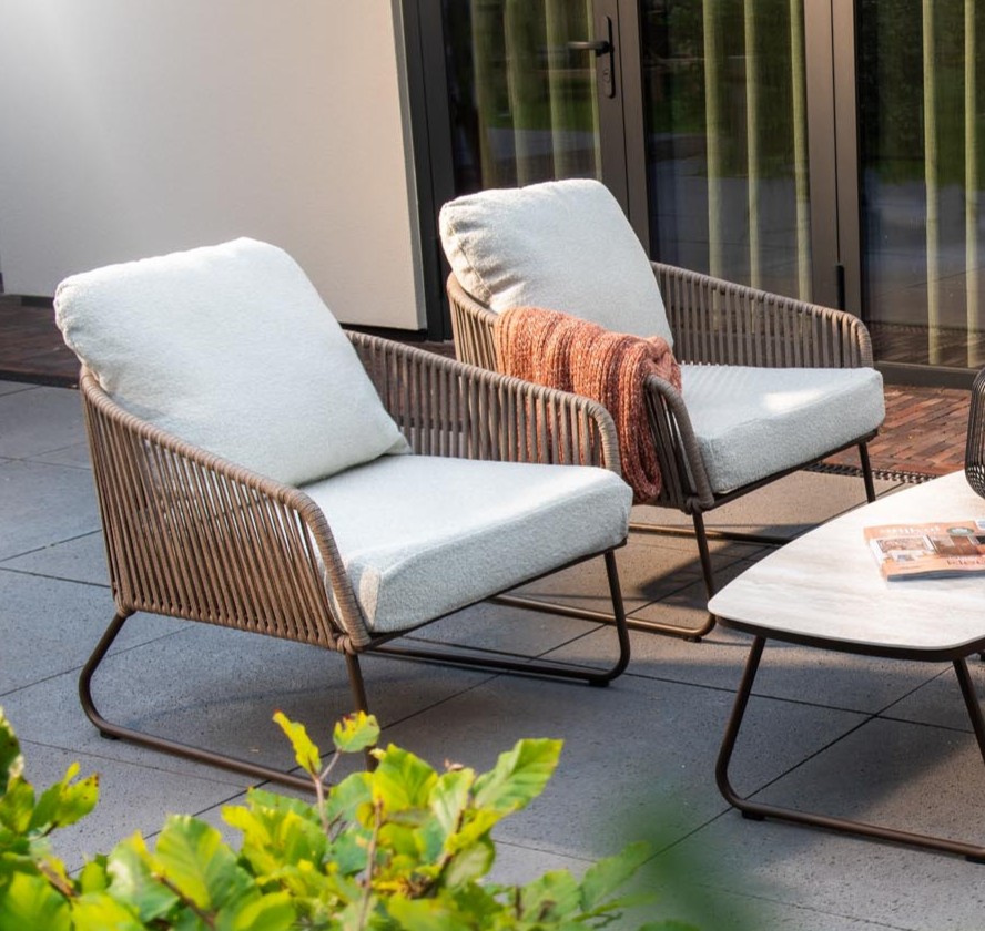 Luxury outdoor lounge seating with bronze accents